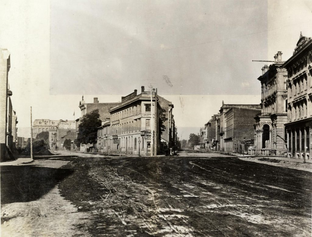 Wellington St. East, looking west from east of Church St., showing also Front St. East.(1872)